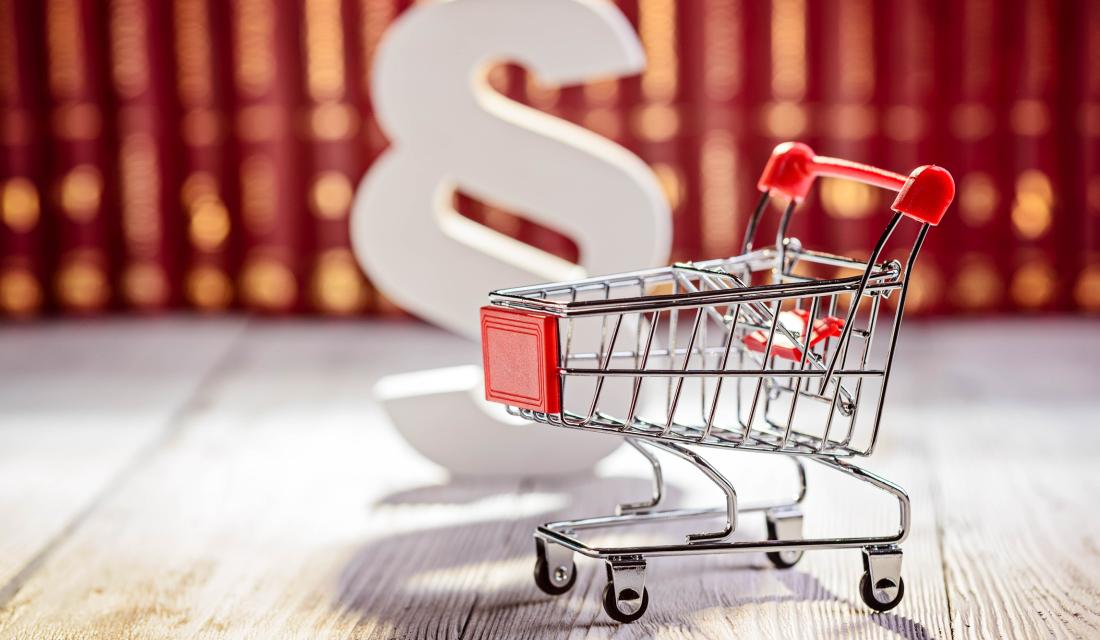 Einkaufswagen und Paragraphenzeichen