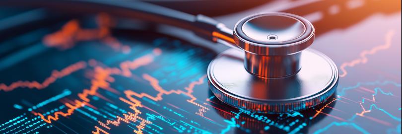 Ein Stethoskop liegt auf einem digitalen Bildschirm, der Herzfrequenzdaten und medizinische Grafiken anzeigt, was die moderne Gesundheitstechnologie symbolisiert.