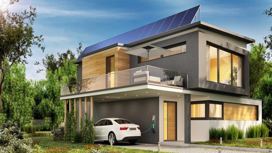 Haus mit Solaranlage und E-Auto in der Garage