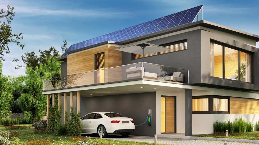 Haus mit Solaranlage und E-Auto in der Garage